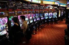 Shinjuku Cosmos Pachinko visitors at the machines