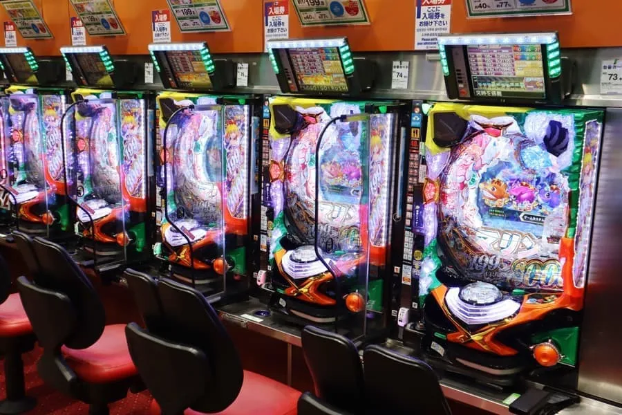 Rows of pachinko machines with steel ball trays